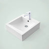 Modern square white Caroma bathroom sink basin with a chrome faucet.