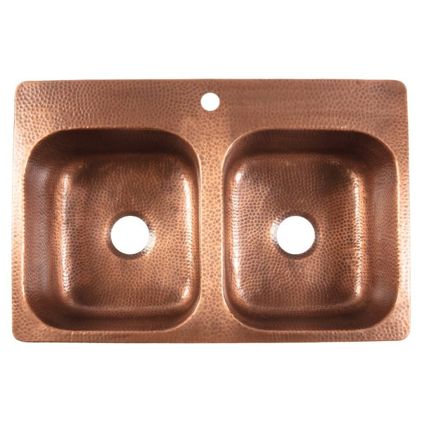 Overhead view of a Sinkology hammered copper double-bowl kitchen sink with a single faucet hole.