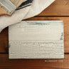 Crackled milk paint finish on a board
